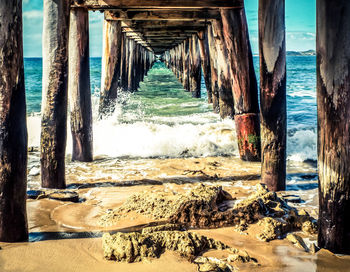 Pier over sea against sky