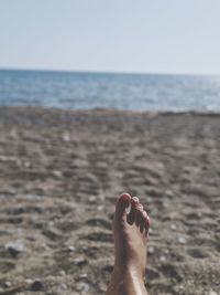 Low section of person on beach