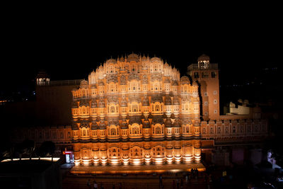 Illuminated buildings in city at night