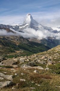 Clouds wrapped around the matterhorn mountain and over the valley in zermatt, switzerland.