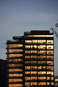 Low angle view of illuminated building against sky