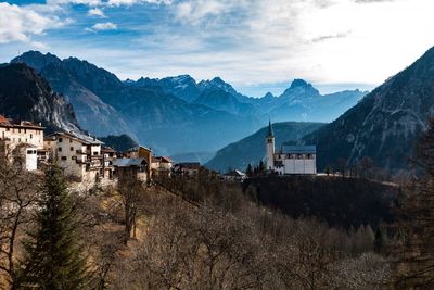 Panoramic view of buildings and mountains against sky