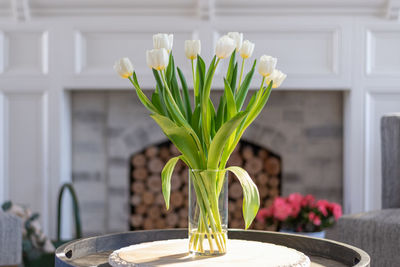 Close-up of flower vase on table at home