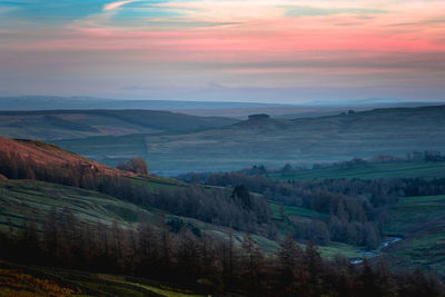 Scenic view of landscape against sky during sunset