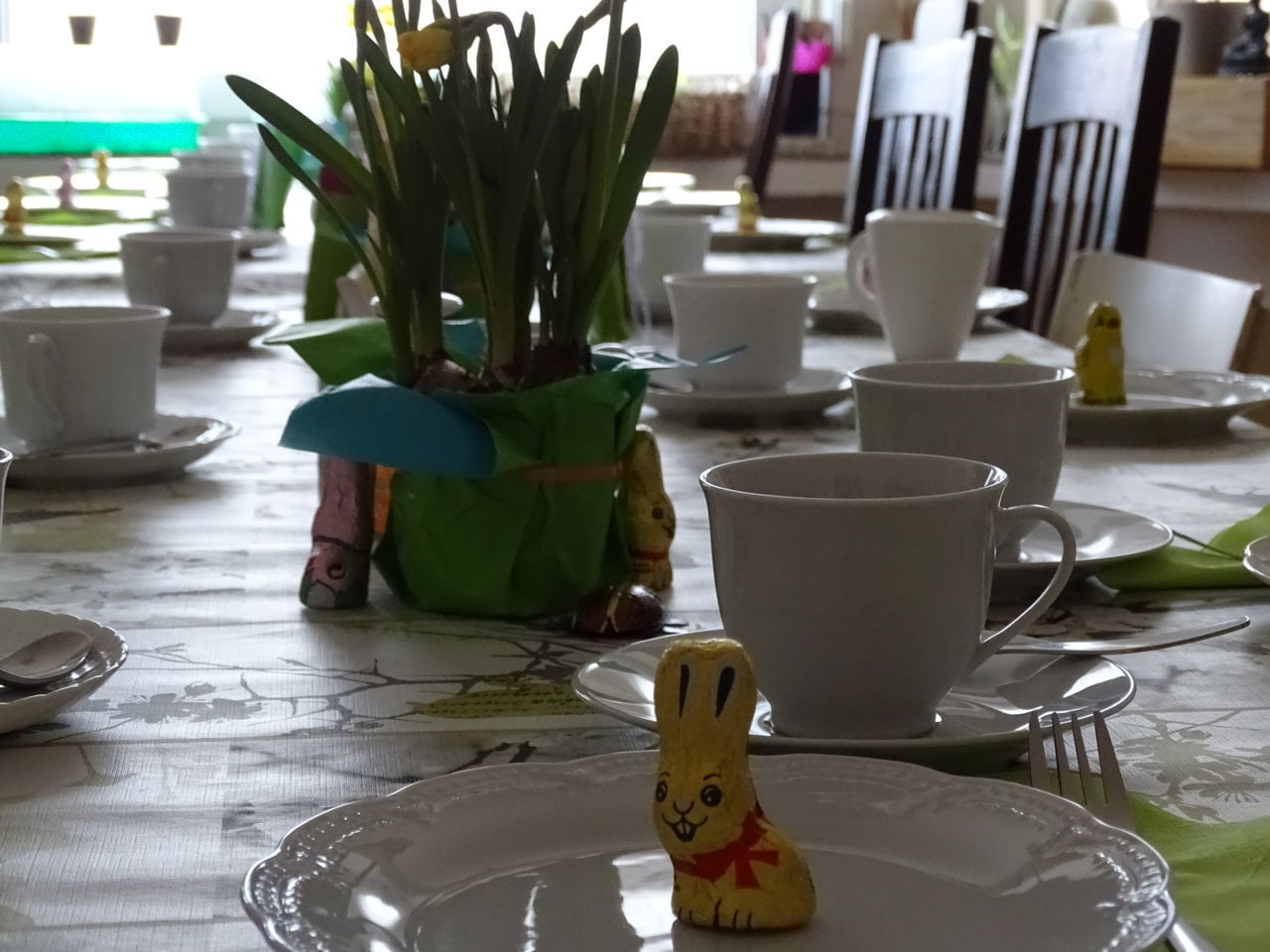 Cups and plates on table at home