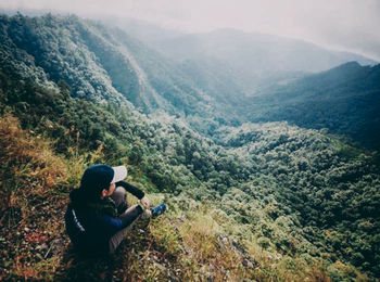 Man sitting on mountain road