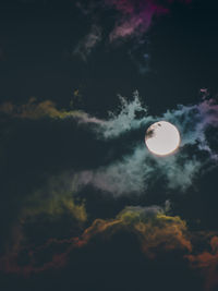 Low angle view of moon against sky at night