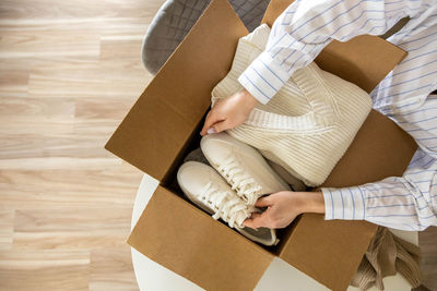 Midsection of woman holding gift box