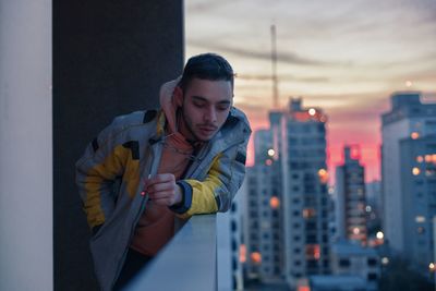 Man smoking marijuana in balcony