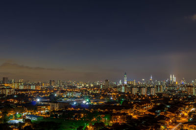 High angle view of illuminated buildings against sky