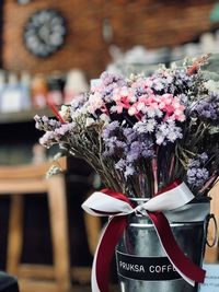 Close-up of white flowering plant against building