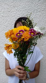 Close-up of woman holding bouquet