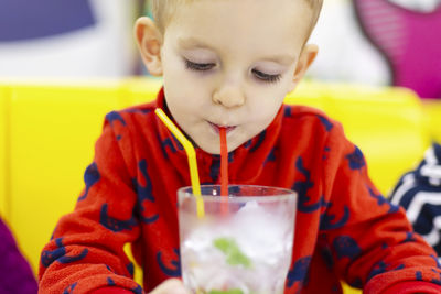 Close-up of young woman eating food