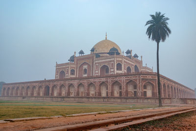 Humayun tomb exterior view at misty morning from unique perspective