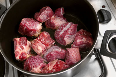 Close-up of meat in cooking pan