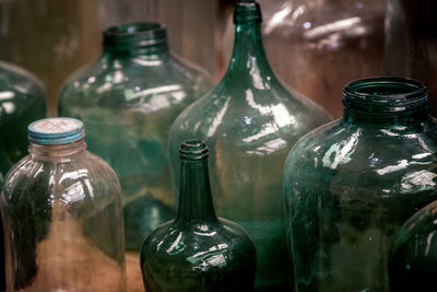 Close-up of wine bottles on table