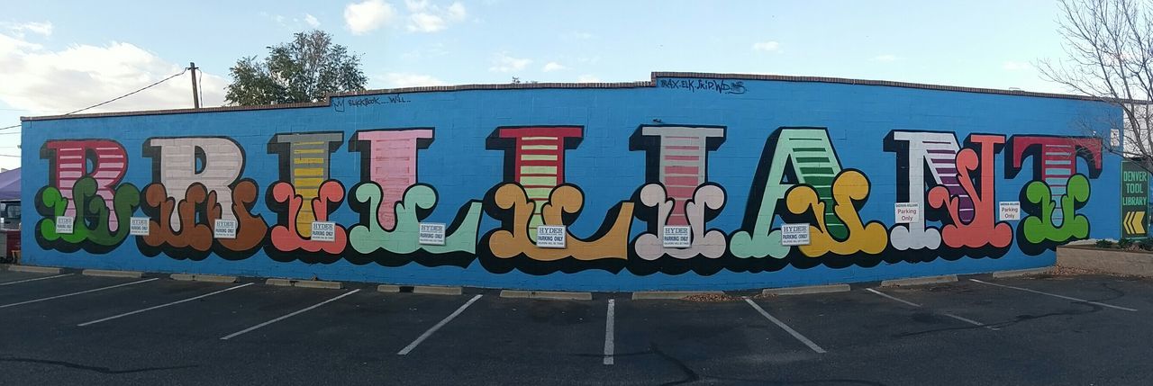 multi colored, spray paint, outdoors, day, building exterior, no people, sky