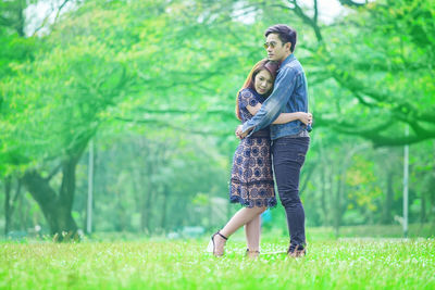 Full length of young woman on grass