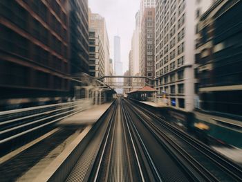 Blurred motion of railroad track in city