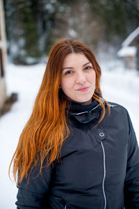 Portrait of young woman in winter