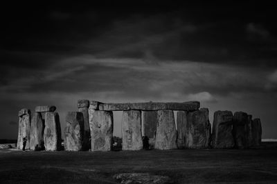 View of standing stones against cloudy sky