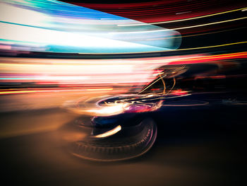 Light trails in amusement park at night