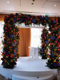 Flowers in vase against wall