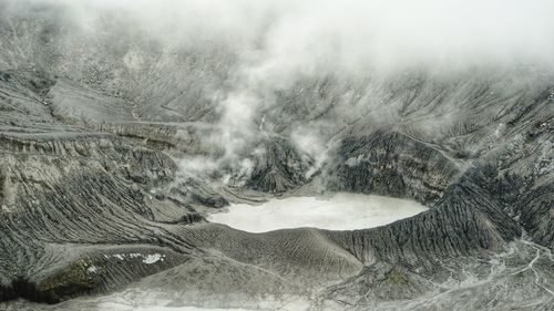 Smoke emitting from volcanic mountain