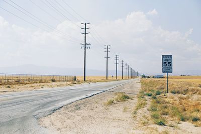 Country road passing through field