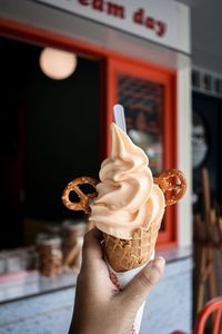 Hand holding ice cream cone