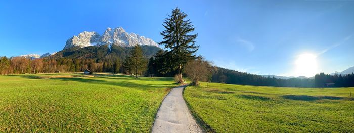 Panoramic view of field against sky