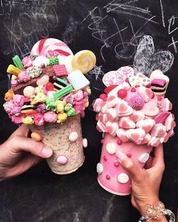 Midsection of woman holding ice cream flowers