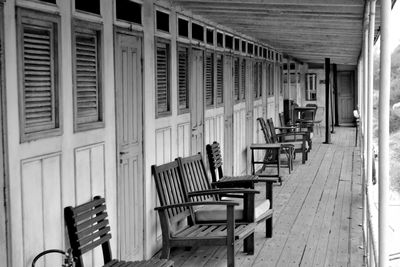 Empty chairs and tables in building