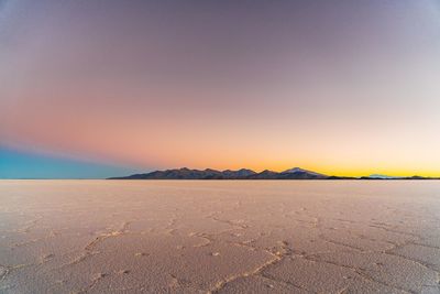 View of desert against sky during sunset