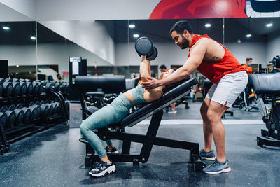 Low section of man exercising in gym