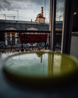 Home in city seen through window