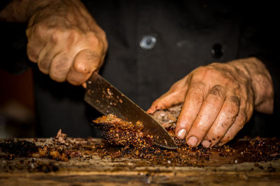 Close-up of man preparing food