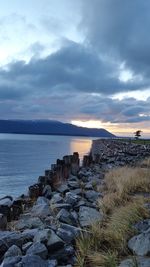 Scenic view of sea against cloudy sky