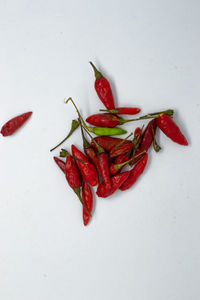 Close-up of red chili pepper against white background