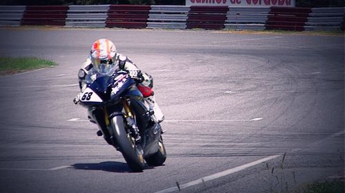 Man riding motorcycle on road