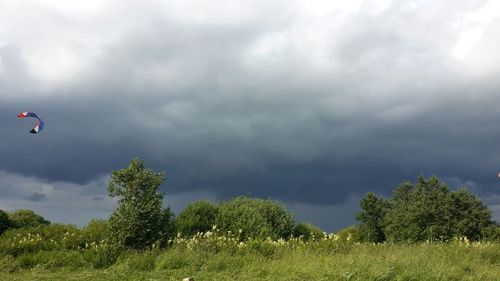 Scenic view of landscape against cloudy sky