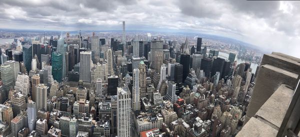 High angle view of modern buildings in city against sky