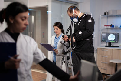 Female doctor examining patient