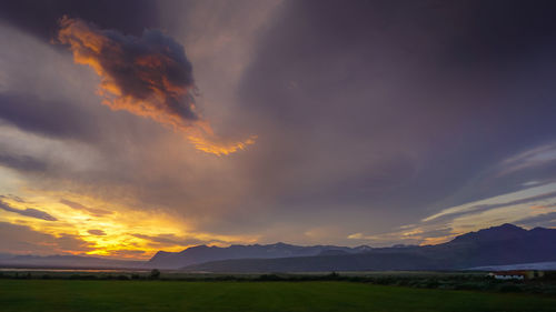 Scenic view of landscape against sky during sunset