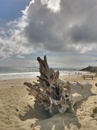 Scenic view of sea against cloudy sky