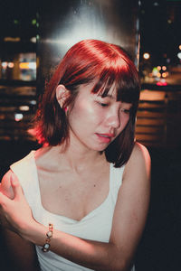 Portrait of young woman looking away