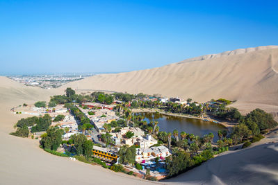 Huacachina against clear blue sky