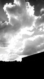 Low angle view of built structure against cloudy sky