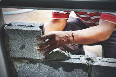 Close-up of man working at construction site