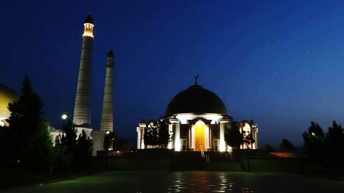 Low angle view of mosque against blue sky